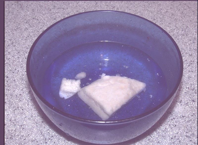 Cheese in bowl covered with Water